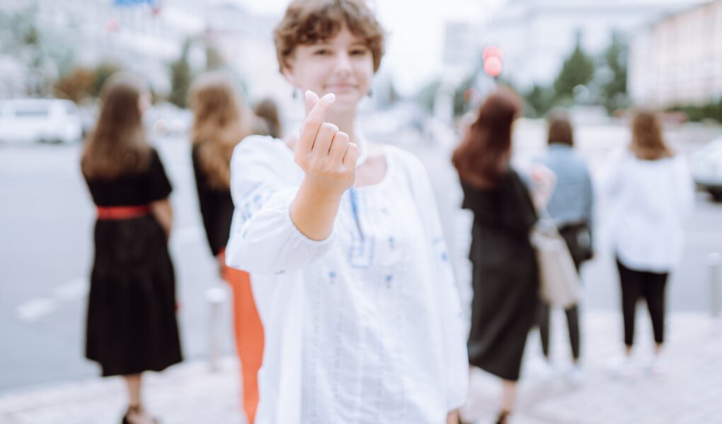 Korean symbol of love with two fingers.
